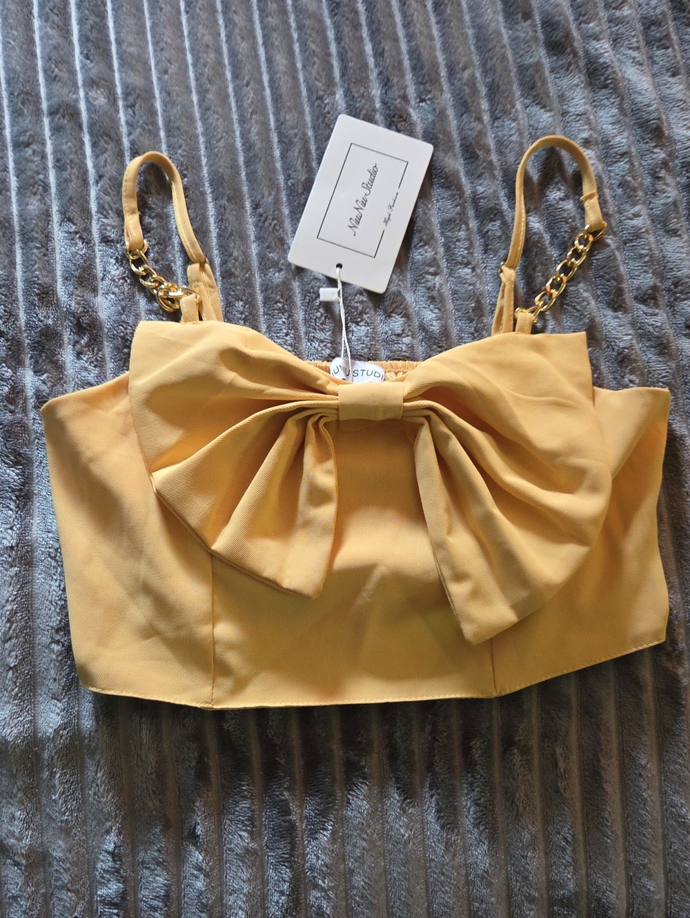 High-Rise Yellow Trousers with Gold Chain Accent and A Cropped Top Matches